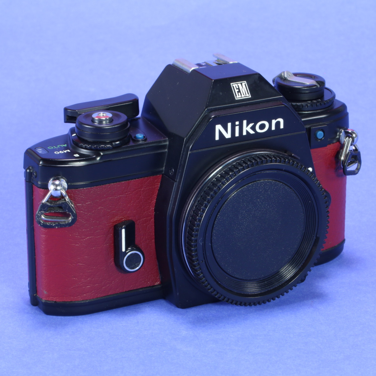 Used Nikon EM Camera – Re-skinned in Maroon Leather | Blue Moon Camera